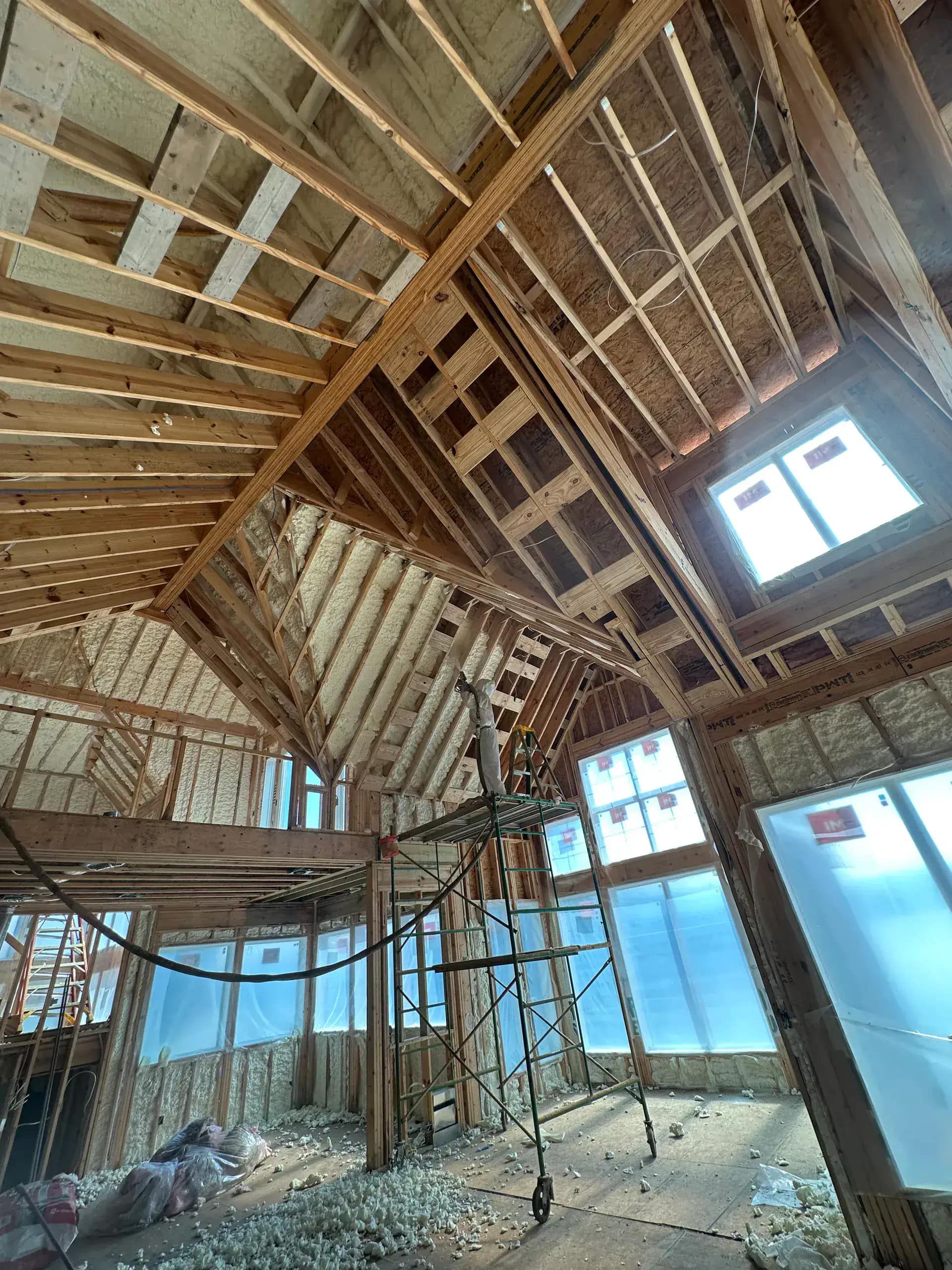 SPFA-certified installer spraying closed-cell foam in a Metro Detroit attic