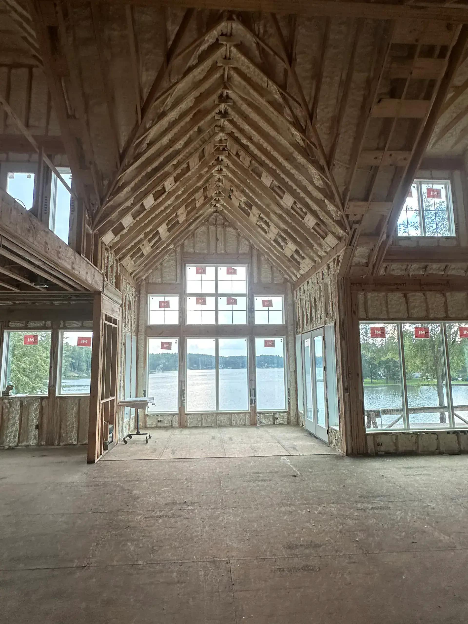 New construction wall system with closed-cell SPF for structural reinforcement