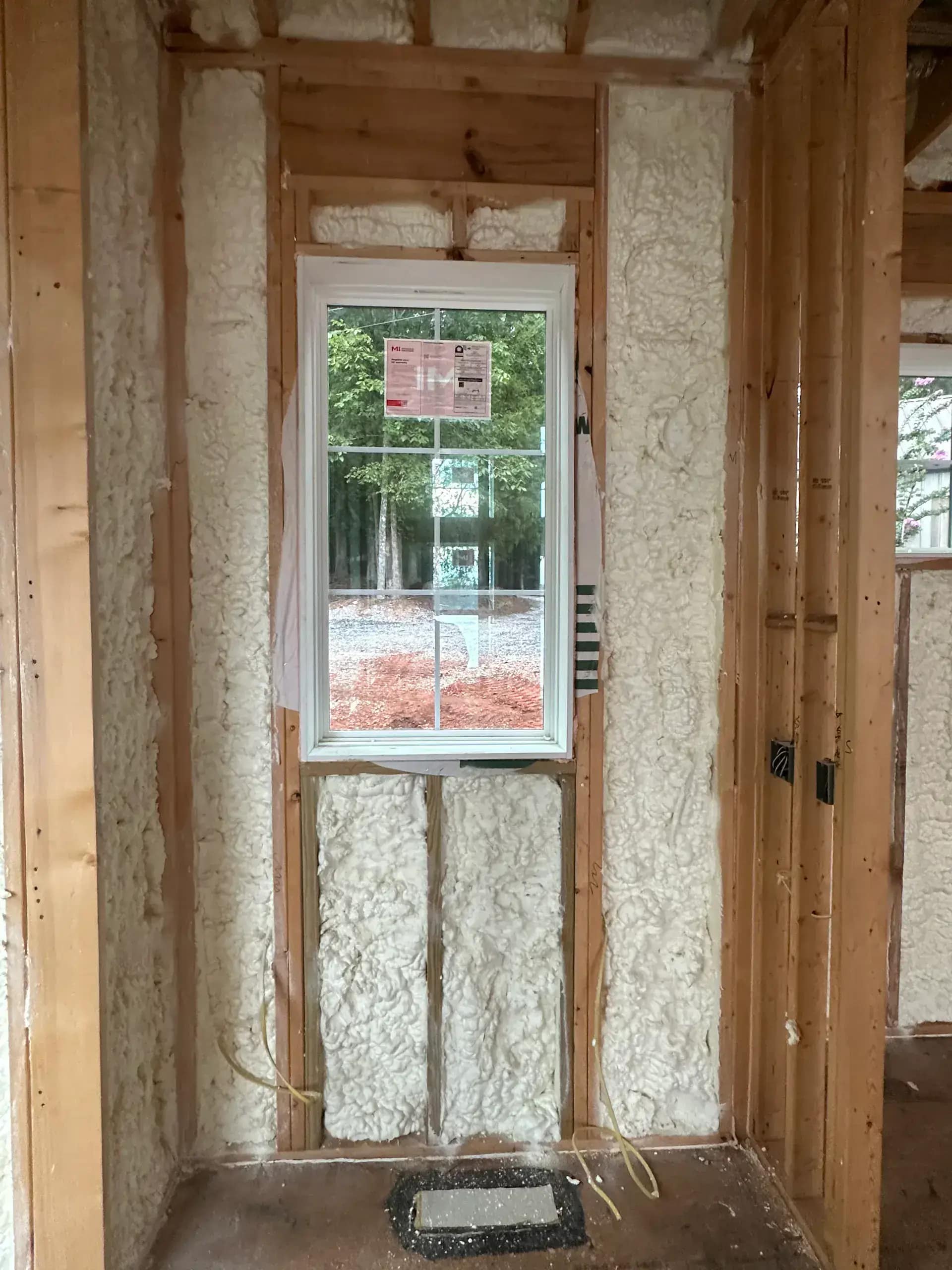 Custom home in Northville MI with premium closed-cell wall system during framing
