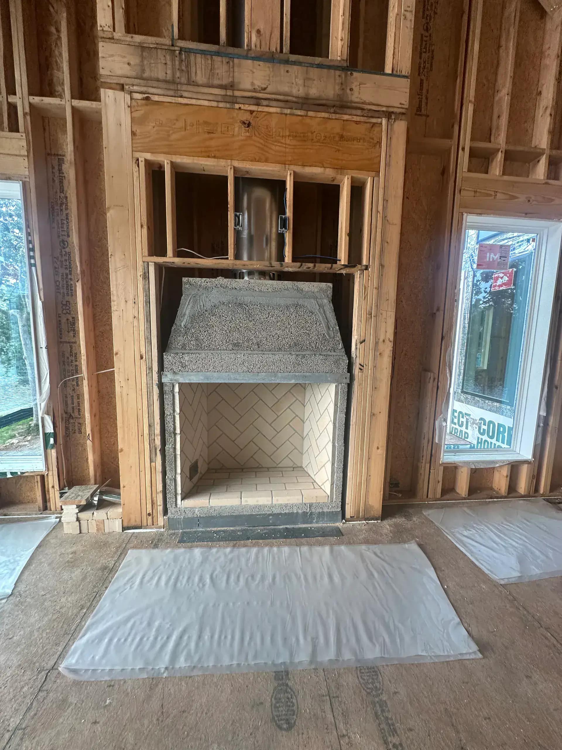 Large vaulted ceiling receiving spray foam insulation in an Oakland County estate