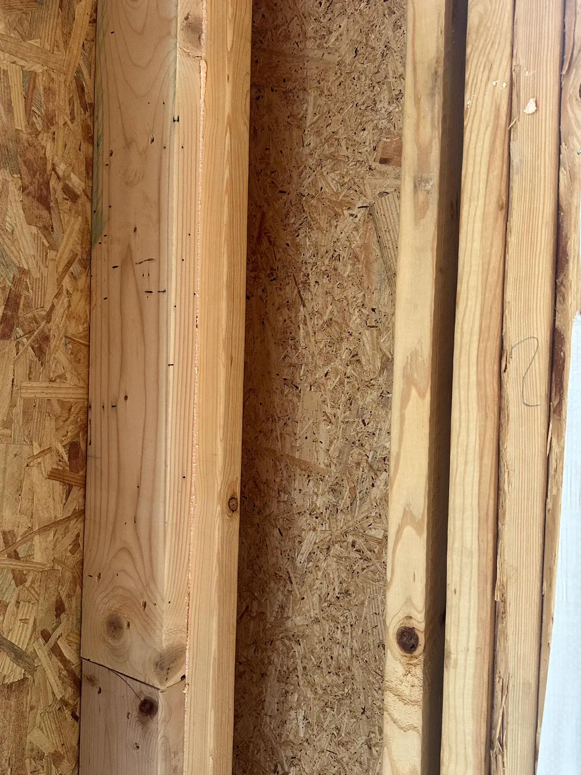 Garage ceiling insulated with closed-cell foam for bonus room temperature control