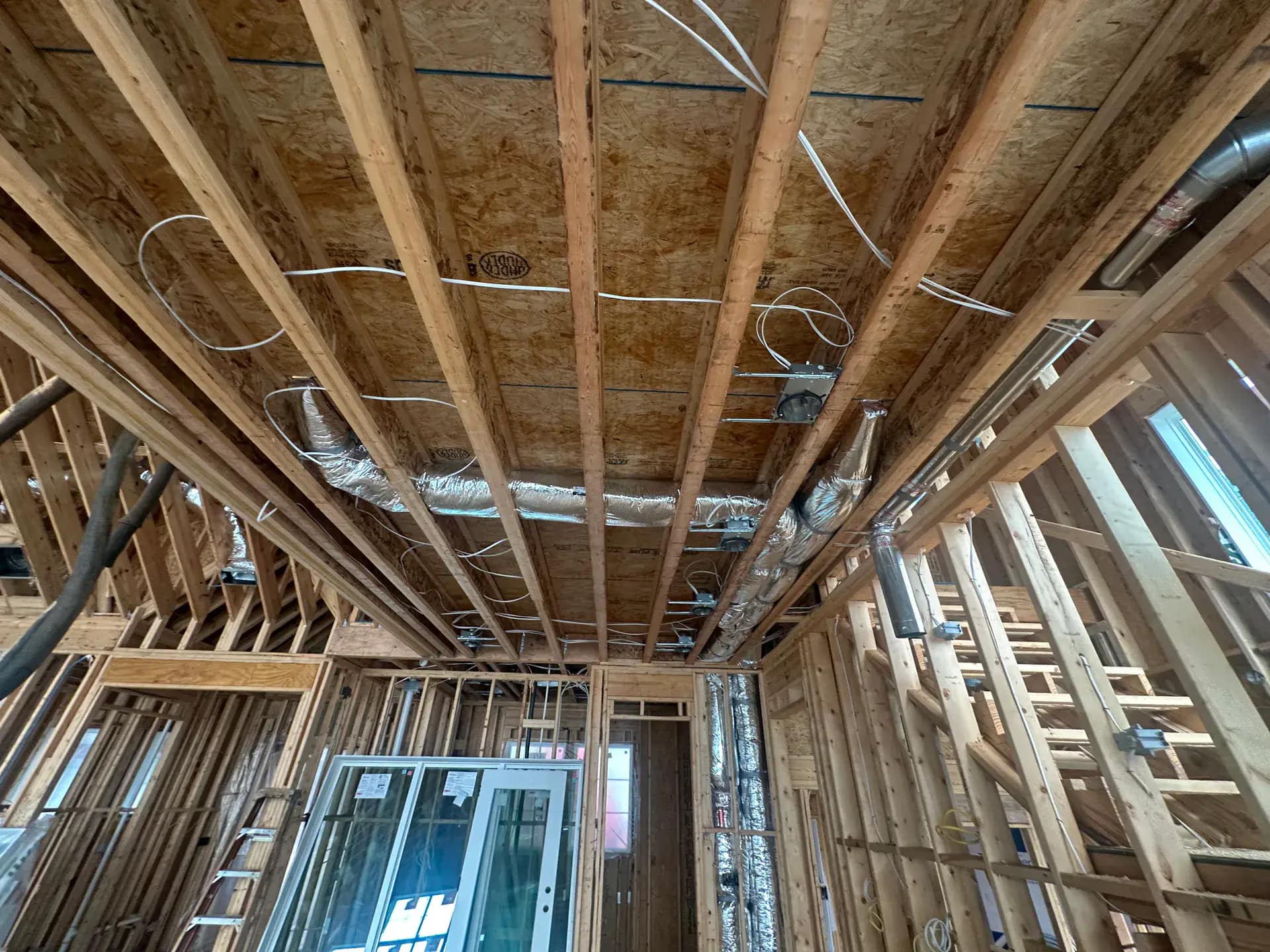Metal building interior with condensation-eliminating closed-cell spray foam