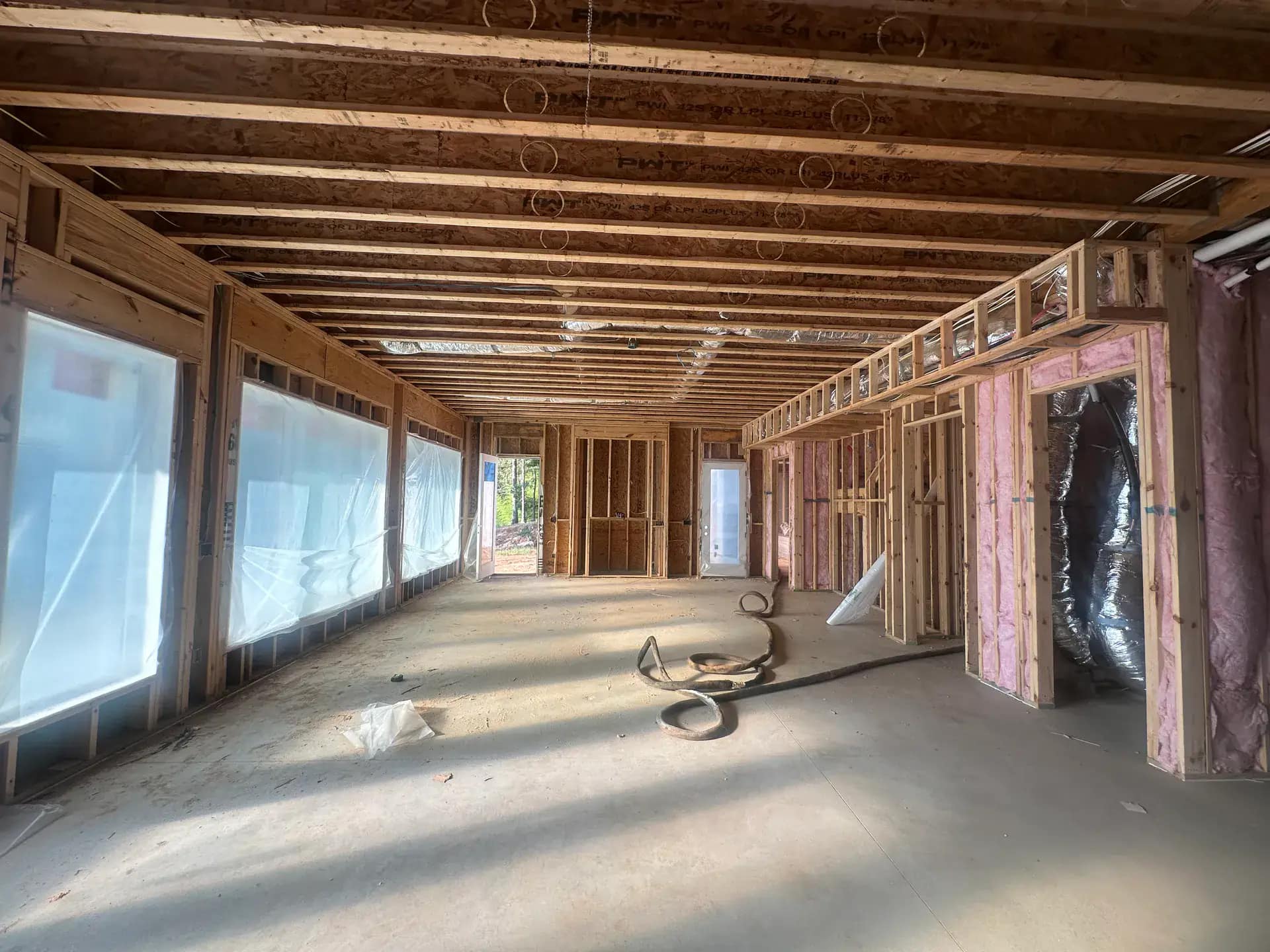 Historic Birmingham MI Tudor home attic receiving spray foam without disturbing original millwork