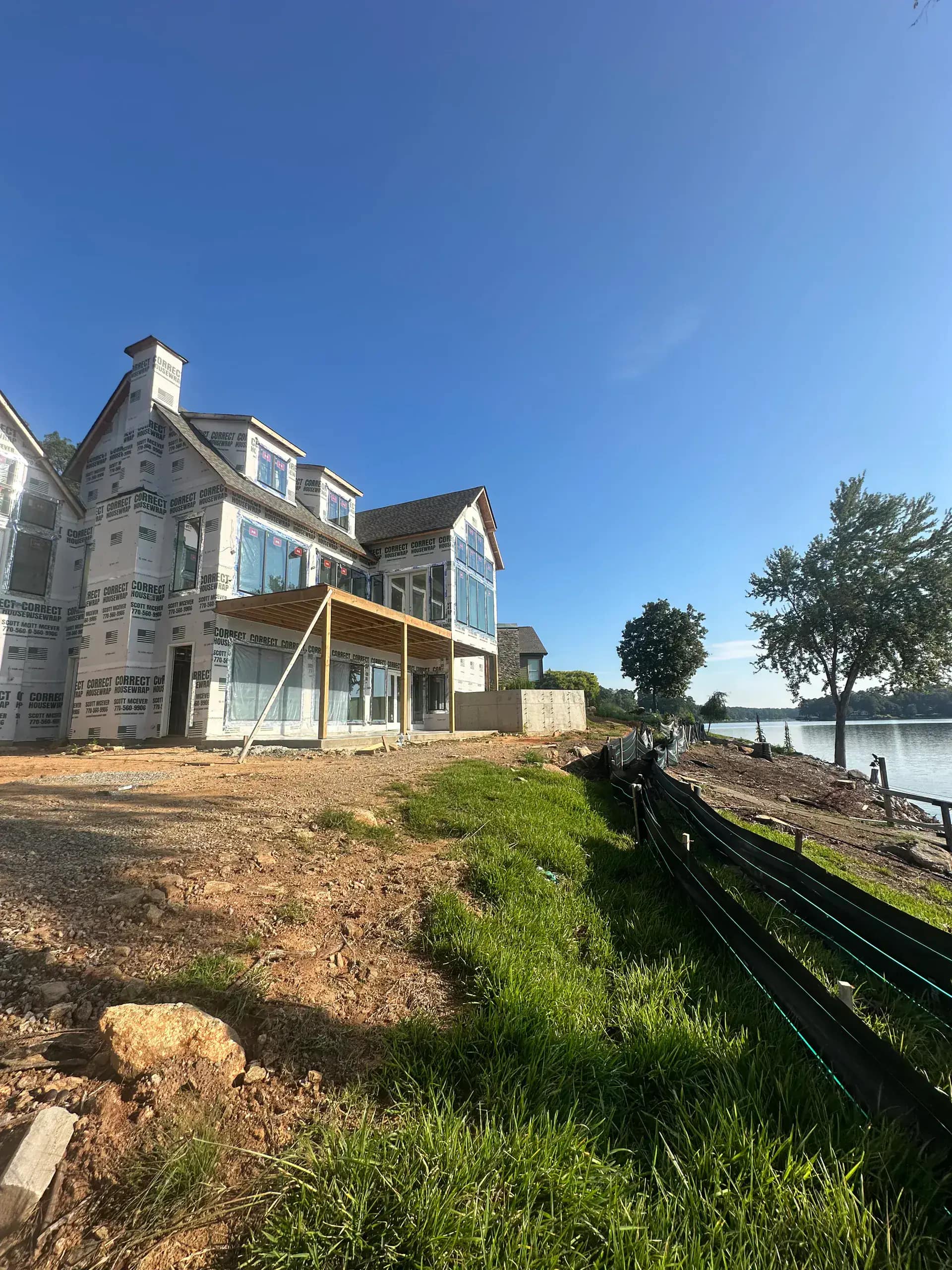Michigan Insulation Pros marked vehicle at a luxury residential project site